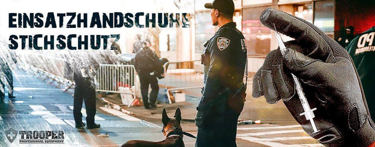 Stichfester Handschuh, der von einer Spritze berührt wird und Einsatzkräfte mit Strassenabsperrung im Hintergrund